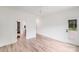 Well-lit bedroom with wood-look floors conveniently located near an en-suite bathroom and walk-in closet at 6907 Lancaster Hwy, Waxhaw, NC 28173