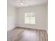 Bright bedroom with modern ceiling fan and wood-look flooring with a window view at 6907 Lancaster Hwy, Waxhaw, NC 28173