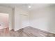 Clean bedroom with wood-look floors, closet and bright white walls at 6907 Lancaster Hwy, Waxhaw, NC 28173