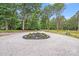 Gravel circular driveway lined with green trees at 6907 Lancaster Hwy, Waxhaw, NC 28173