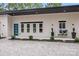 Eye-catching modern home featuring a blue entry door and manicured landscape at 6907 Lancaster Hwy, Waxhaw, NC 28173