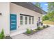 Charming modern home with a blue entry door and manicured landscape at 6907 Lancaster Hwy, Waxhaw, NC 28173