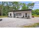 Contemporary home with a gravel driveway and modern architectural details at 6907 Lancaster Hwy, Waxhaw, NC 28173