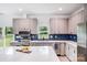 Bright kitchen features modern cabinets, stainless steel appliances, an island, and sleek countertops at 6907 Lancaster Hwy, Waxhaw, NC 28173