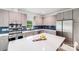 Bright kitchen features modern cabinets, stainless steel appliances, an island, and sleek countertops at 6907 Lancaster Hwy, Waxhaw, NC 28173