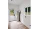 Functional laundry room with new appliances and a view from the window at 6907 Lancaster Hwy, Waxhaw, NC 28173