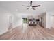 Open-concept living space featuring a kitchen island and light, airy flooring at 6907 Lancaster Hwy, Waxhaw, NC 28173