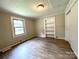 Cozy bedroom with neutral walls, built-in shelving, and attractive flooring at 717 Wilshire Sw Ave, Concord, NC 28025