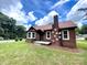 Charming brick home with well-kept lawn, classic design, and inviting entrance at 717 Wilshire Sw Ave, Concord, NC 28025