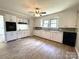 Bright kitchen featuring sleek countertops, white cabinetry, and modern appliances at 717 Wilshire Sw Ave, Concord, NC 28025