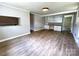 Inviting living room featuring neutral walls, attractive flooring, and an open layout at 717 Wilshire Sw Ave, Concord, NC 28025