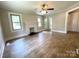 Inviting living room featuring neutral walls, bright windows, decorative fireplace, and stylish floors at 717 Wilshire Sw Ave, Concord, NC 28025