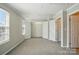 Bedroom with carpet, ample closet space and natural light at 7753 Jackson Pond Dr, Charlotte, NC 28273