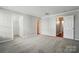 Neutral bedroom featuring soft carpet, white trim, and ample space for furniture and personal touches at 7753 Jackson Pond Dr, Charlotte, NC 28273