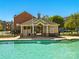 Inviting community pool with bright blue water and a covered lounge area for residents to enjoy on sunny days at 7753 Jackson Pond Dr, Charlotte, NC 28273