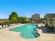 Relaxing community pool area with lounge chairs, perfect for summer days at 7753 Jackson Pond Dr, Charlotte, NC 28273