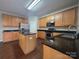 Large kitchen equipped with stainless steel appliances and granite countertops at 8323 Carolina Laurel Ct, Charlotte, NC 28215