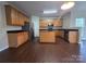 Open kitchen featuring stainless steel appliances, a central island, and ample cabinet space at 8323 Carolina Laurel Ct, Charlotte, NC 28215