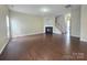 Spacious living room with hardwood floors and a cozy fireplace at 8323 Carolina Laurel Ct, Charlotte, NC 28215