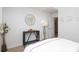 Cozy bedroom featuring a dark console table, white flowers and comfortable carpet at 879 Park Slope Dr, Charlotte, NC 28209