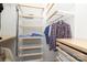 Organized walk-in closet offering adjustable shelving, hanging rods, and drawer storage at 879 Park Slope Dr, Charlotte, NC 28209