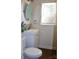 Bathroom featuring a white vanity, toilet, and a window at 920 Squirrel Hill Rd, Charlotte, NC 28213