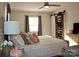 Comfortable bedroom with neutral tones, a ceiling fan, and ample natural light, ideal for restful nights at 920 Squirrel Hill Rd, Charlotte, NC 28213