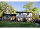 Lovely two-story home with brick accents and a vibrant yellow front door at 920 Squirrel Hill Rd, Charlotte, NC 28213