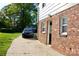 Exterior of a brick home with a black car in the driveway at 920 Squirrel Hill Rd, Charlotte, NC 28213