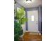 A welcoming foyer with hardwood floors, soft gray walls, and a charming 'HOME' doormat at 920 Squirrel Hill Rd, Charlotte, NC 28213
