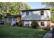 Charming brick home with a bright yellow door and well-maintained lawn at 920 Squirrel Hill Rd, Charlotte, NC 28213