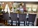Well-appointed kitchen with an island featuring bar seating, stainless appliances, and hardwood floors at 920 Squirrel Hill Rd, Charlotte, NC 28213