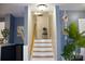 Staircase leading upstairs, with white risers and hardwood steps, complemented by soft gray walls at 920 Squirrel Hill Rd, Charlotte, NC 28213