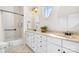 Bathroom features a double vanity, shower and tub combination and attractive light fixture at 962 Blakeley Walk, Rock Hill, SC 29732