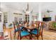 Open-concept dining room with stylish table, seating for six, hardwood floors, and bright natural light at 962 Blakeley Walk, Rock Hill, SC 29732