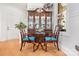 Well-lit dining nook showcasing a wooden hutch and two comfortable chairs with blue cushions at 962 Blakeley Walk, Rock Hill, SC 29732