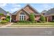 Charming brick home with manicured landscaping, decorative windows, and inviting curb appeal at 962 Blakeley Walk, Rock Hill, SC 29732