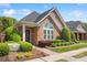 Beautiful brick home featuring well-maintained landscaping and a welcoming entrance at 962 Blakeley Walk, Rock Hill, SC 29732