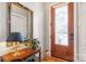Elegant foyer featuring hardwood floors, decorative door, table and stylish mirror at 962 Blakeley Walk, Rock Hill, SC 29732