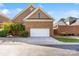 Two-car garage with ample parking space and mature landscaping at 962 Blakeley Walk, Rock Hill, SC 29732