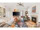 Open-concept living space featuring hardwood floors, fireplace, and abundant natural light at 962 Blakeley Walk, Rock Hill, SC 29732