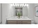 Bathroom features double vanity, ample counter space, and a large framed mirror at 10033 Guardian Dr # 265, Charlotte, NC 28273