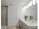 Bright bathroom features a double vanity with modern fixtures and a glass-enclosed shower at 10033 Guardian Dr # 265, Charlotte, NC 28273