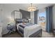 Comfortable bedroom boasts natural light, contemporary decor, and serene ambiance for a relaxing retreat at 10033 Guardian Dr # 265, Charlotte, NC 28273