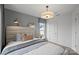 Bright bedroom features stylish decor, large window, and modern lighting for a cozy and inviting space at 10033 Guardian Dr # 265, Charlotte, NC 28273