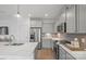 Well-lit kitchen features modern stainless-steel appliances, sleek countertops, and ample cabinet space at 10033 Guardian Dr # 265, Charlotte, NC 28273