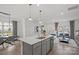 Spacious kitchen island overlooks the open-concept living and dining areas, perfect for entertaining at 10033 Guardian Dr # 265, Charlotte, NC 28273