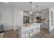 Bright, open kitchen featuring a large island with seating, stainless steel appliances, and an open layout at 10033 Guardian Dr # 265, Charlotte, NC 28273