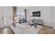 Stylish living room with large window, modern decor, and hardwood floors offers a comfortable space at 10033 Guardian Dr # 265, Charlotte, NC 28273