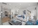 Open-concept living spaces flow seamlessly, showcasing a modern kitchen, dining area, and cozy living room at 10033 Guardian Dr # 265, Charlotte, NC 28273